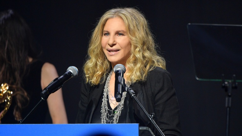 Barbra Streisand accepts her award onstage at the UCLA IoES