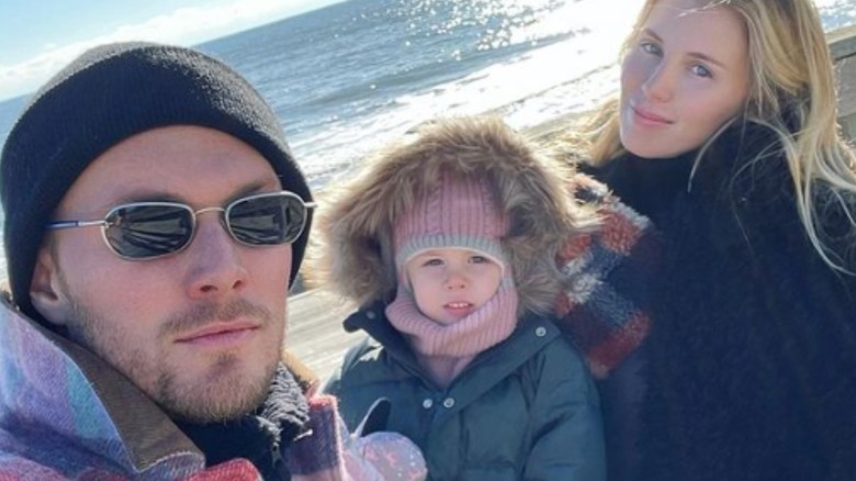 Barron Hilton, wife, daughter at beach