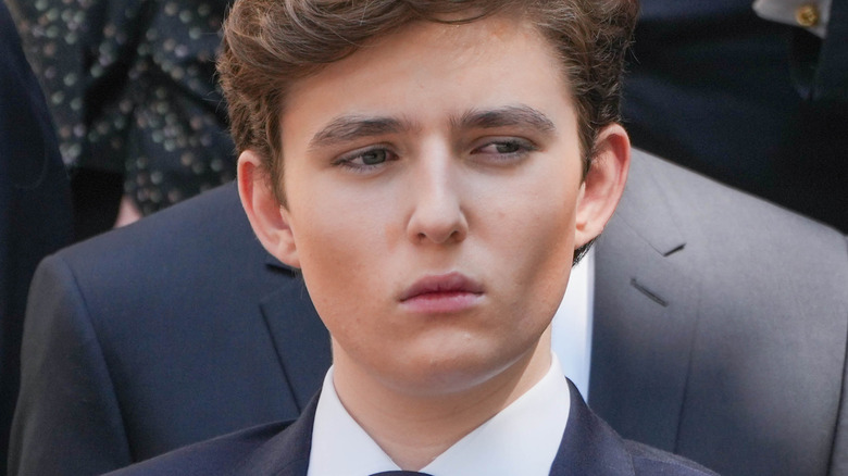Barron Trump in a suit at the funeral of Ivana Trump.
