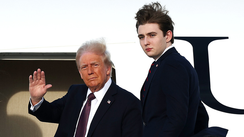 Donald Trump waving next to Barron Trump