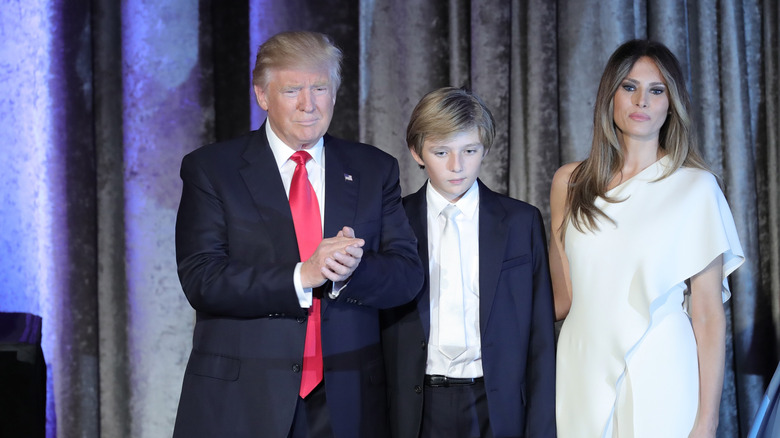 Donald, Barron, and Melania Trump stand onstage during election night
