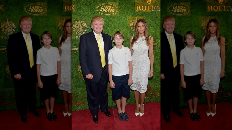 Barron Trump stands with his parents, Donald and Melania Trump