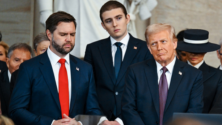 Barron Trump towering over Vice President JD Vance and President Donald Trump