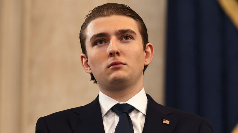 Barron Trump looking off in the distance