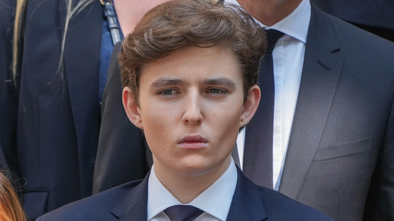 Barron Trump looking off to the side