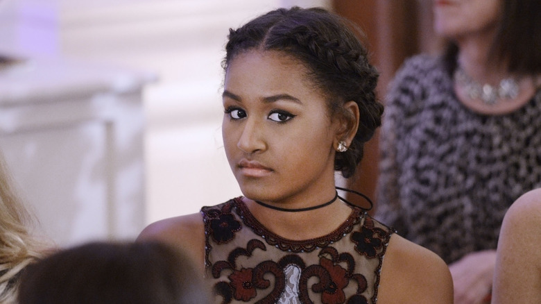 Sasha Obama looking to the side