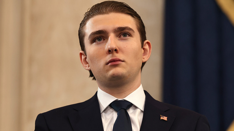 Barron Trump with a blank stare