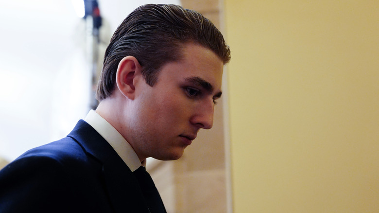 Barron Trump wearing a suit