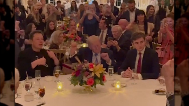 Elon Musk, Donald Trump, and Barron Trump seated at Mar-a-Lago table on Thanksgiving