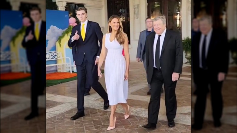 Barron Trump giving a thumbs up outside Mar-a-Lago with Melania Trump and Viktor Knavs