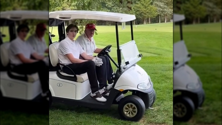 Donald Trump and Barron Trump in a golf cart