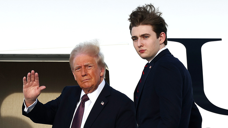Donald Trump waving next to Barron Trump
