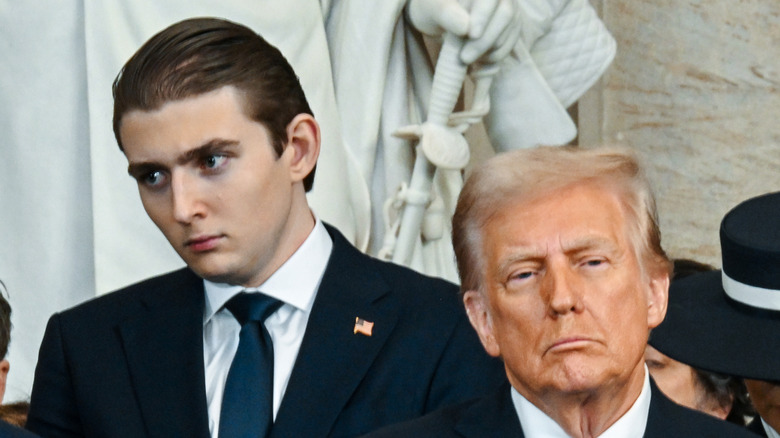 Barron Trump lookin annoyed behind Donald Trump