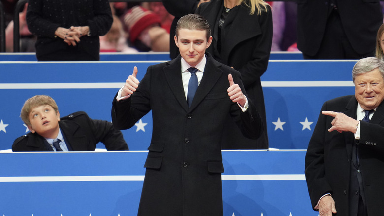 Barron Trump giving thumbs up at the Capital One Arena