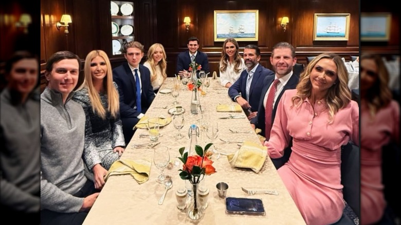 The Trump family smiling at a table