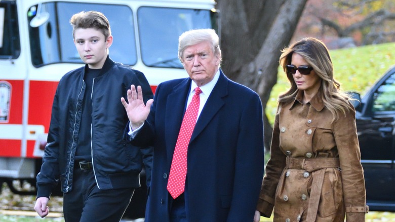 Barron Trump, Donald Trump, Melania Trump walking