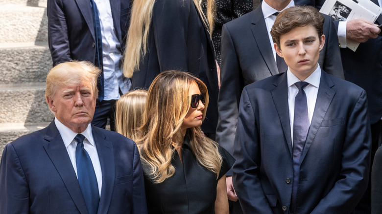 Barron Trump towering over his parents in 2022