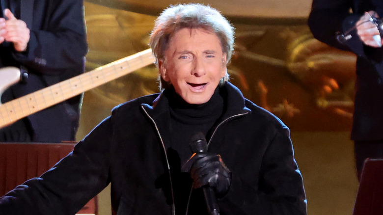 Barry Manilow singing into microphone