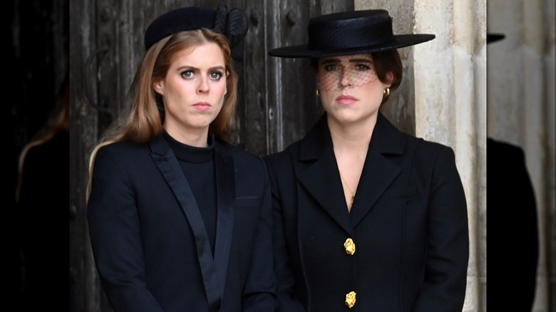 Princess Beatrice and Princess Eugenie frowning