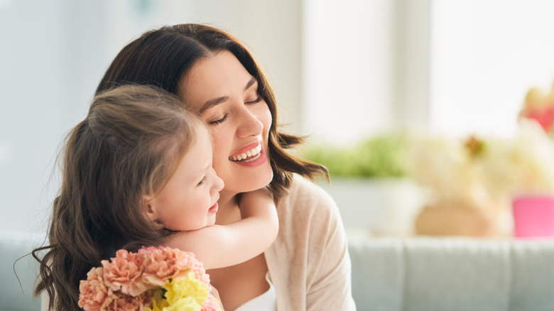 Mother and daughter hugging