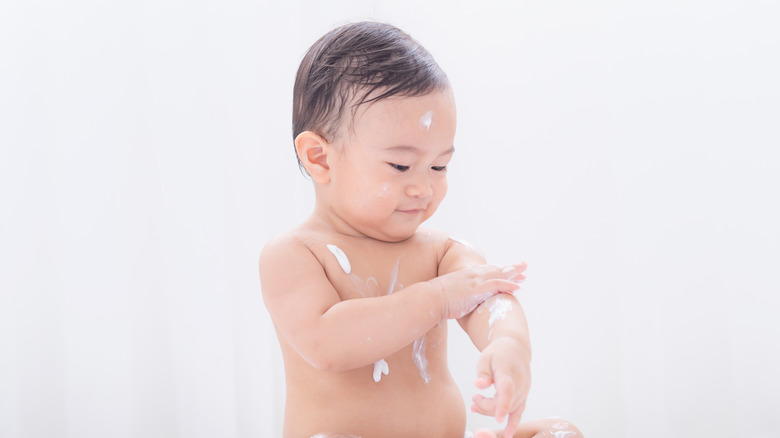 Baby with lotion