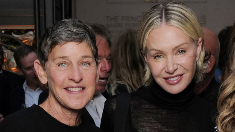 Ellen DeGeneres and Portia de Rossi wearing black at a function