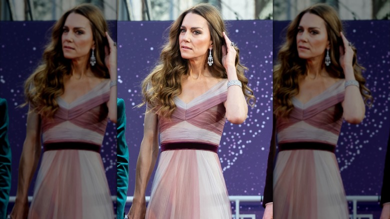 Kate Middleton fixing her hair