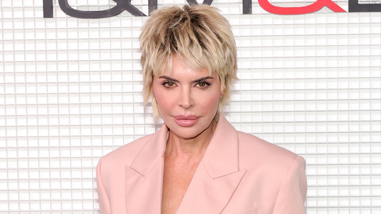 Lisa Rinna in a pink suit with blond hair