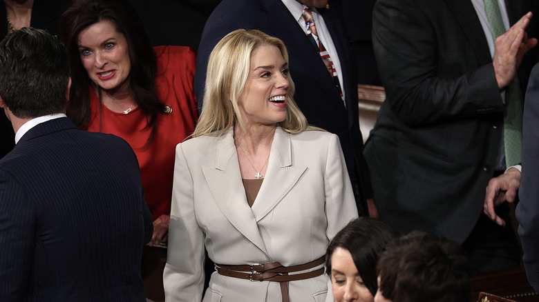Pam Bondi smiling and looking to the side