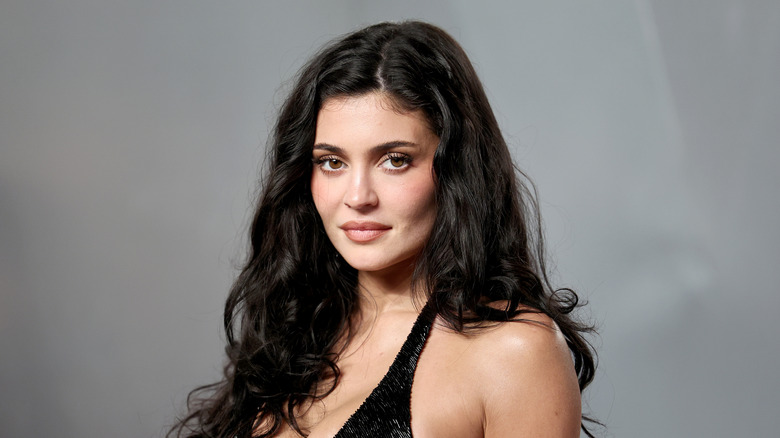 Kylie Jenner attends the Vanity Fair Oscar party red carpet in a sparkly black dress