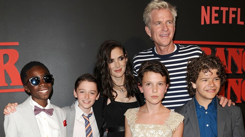 (Clockwise) Caleb McLaughlin, Noah Schnapp, Winona Ryder, Matthew Modine, Gaten Matarazzo, and Millie Bobby Brown at the Season 1 premiere of 'Stranger Things' (2016)