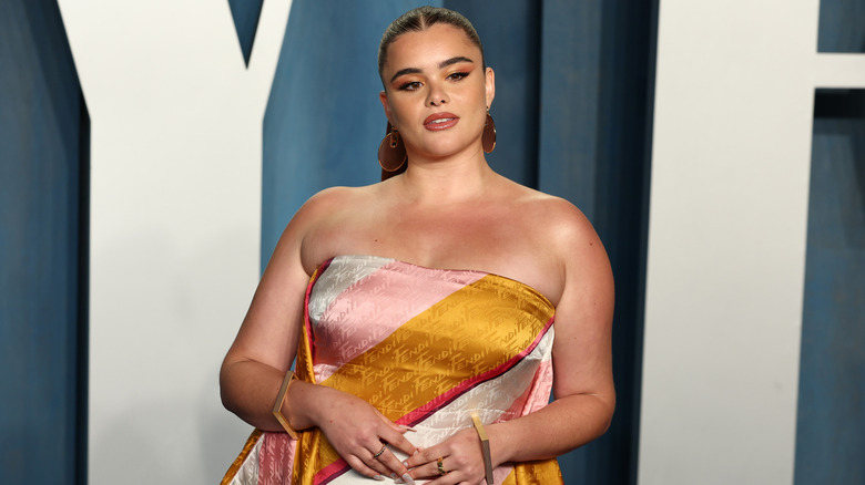 Barbie Ferreira posing on the red carpet in a colorful Fendi dress