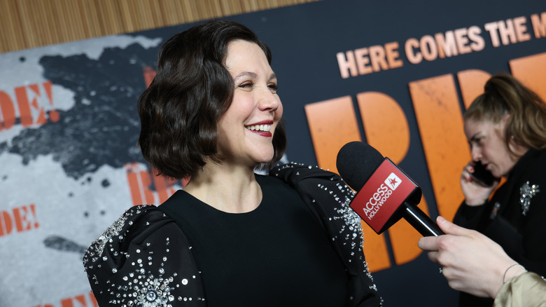 Maggie Gyllenhaal beaming as she's interviewed by Access Hollywood at the New York premiere of "The Bride"