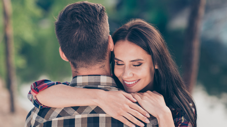woman hugging man