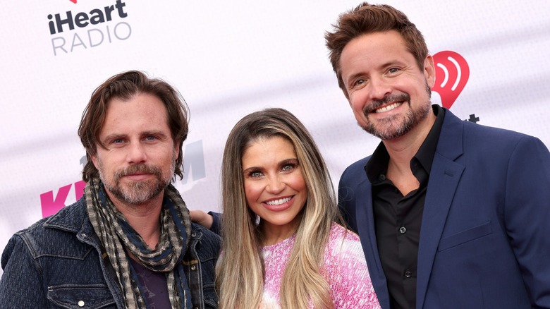 Rider Strong, Danielle Fishel, and Will Friedle smiling at the 2022 iHeartRadio Awards