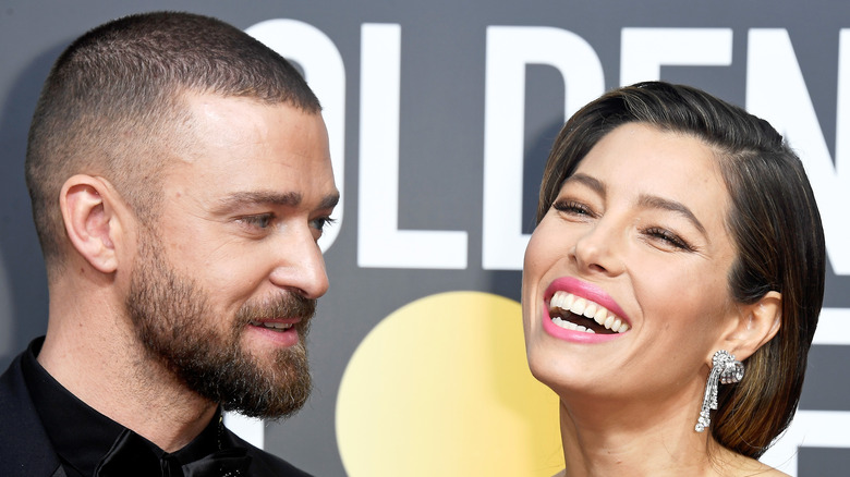 Jessica Biel laughing next to Justin Timberlake