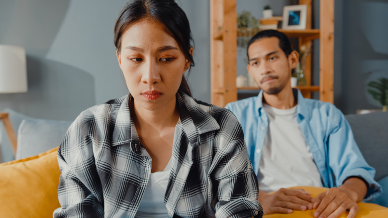 man staring woman from behind