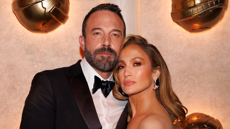 Ben Affleck and Jennifer Lopez embrace at red carpet event