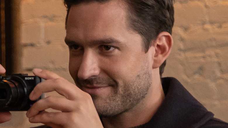 Ben Aldridge holding camera in Spoiler Alert