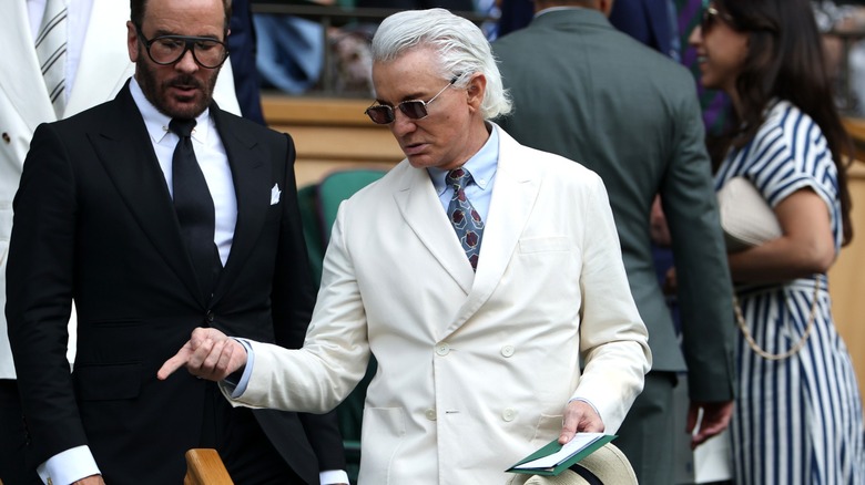 Baz Luhrmann and Tom Ford finding their seats at Wimbledon.