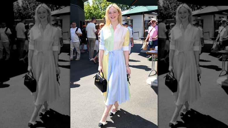 Elle Fanning smiling in a pastel colored dress at Wimbledon 2026.
