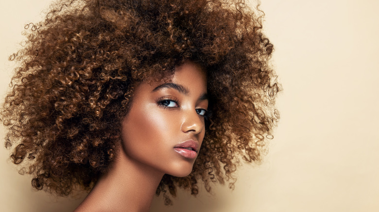 model shows off subtle glowing makeup