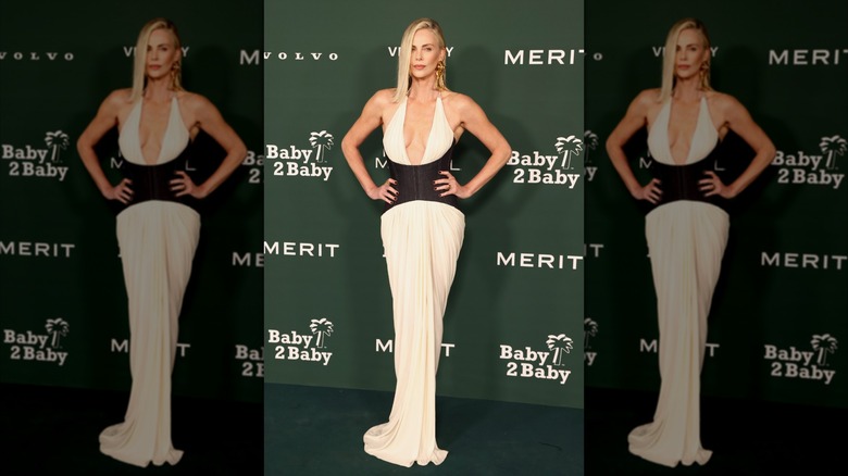 Charlize Theron posing with her hands on her hips