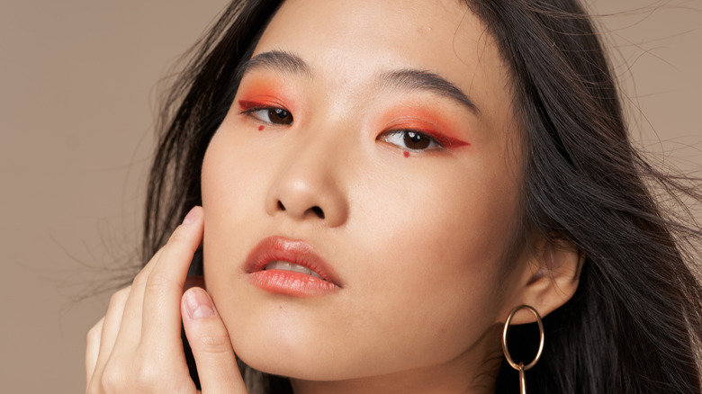 Woman wearing orange eyeshadow