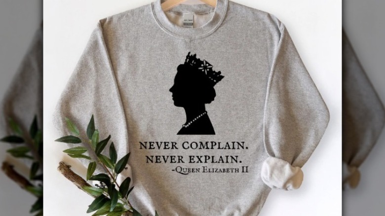 sweatshirt on white backdrop with greenery