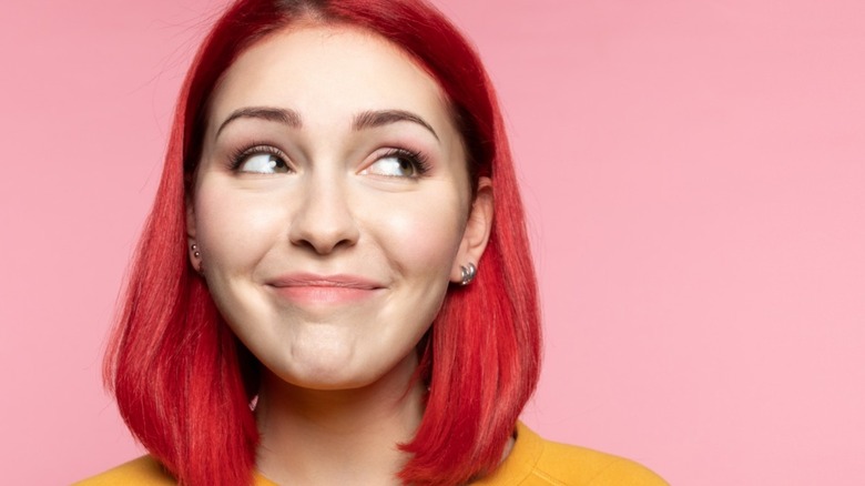 woman with bright colored hair smiling