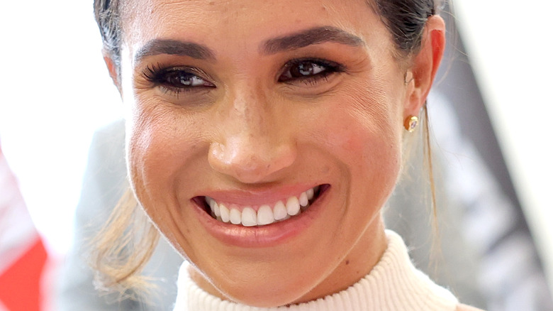 Meghan Markle hair in bun smiling