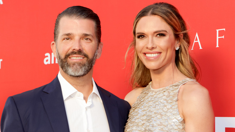 Donald Trump Jr. and Bettina Anderson red background