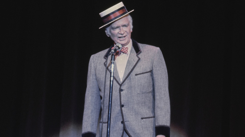 Buddy Ebsen wearing a suit, a bow tie, and a hat