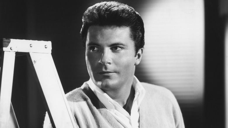 Max Baer Jr. next to a ladder